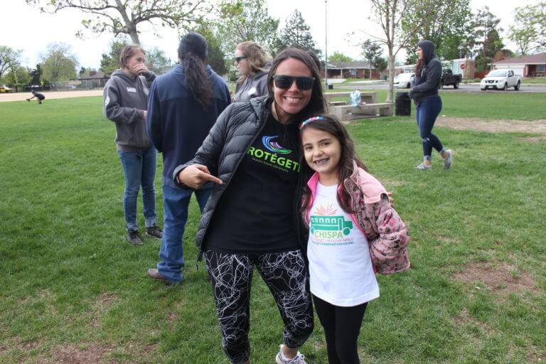 Community organizer, Finangi, celebrates Colorado Public Lands Day with her daughter.