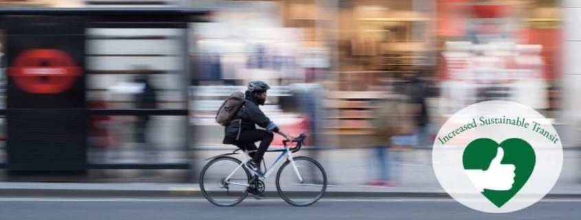 Bicyclist riding through city: increased sustainable transit