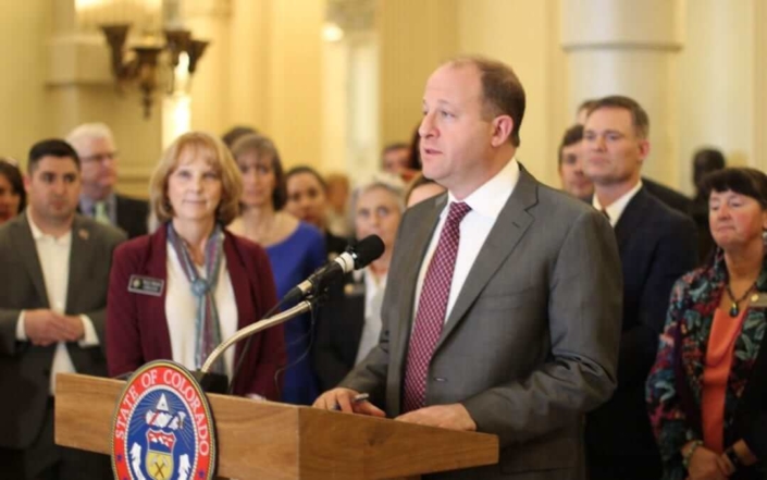 Governor Jared Polis announces a bill to prioritize public health, safety, and environment over oil and gas