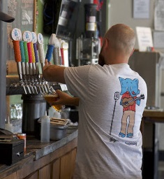 Dave Bergen pours a beer on tap at Joyride Brewing