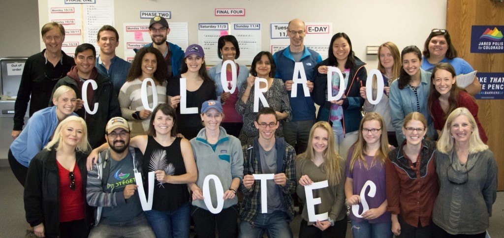 Colorado voters hold letters spelling out "Colorado Votes"